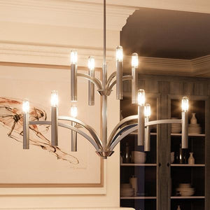 A beautiful UHP2276 Modern Chandelier from Urban Ambiance hanging over a dining room table.