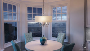 A beautiful dining room with a view of the ocean featuring the Urban Ambiance UHP2280 Transitional Chandelier, 21-1/8