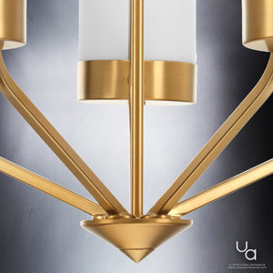 Close-up of the Urban Ambiance UHP2301 Contemporary Chandelier from the Madison Collection, featuring gold metal arms and white cylindrical shades in a brushed bronze finish, set against a neutral background.