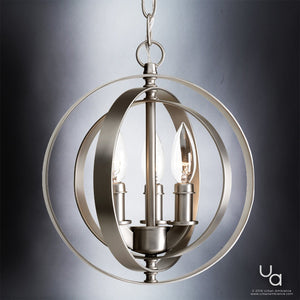 Suspended by a chain against a gradient background, the UHP2320 Luxe Industrial Pendant from the Arezzo Collection features three candle-style bulbs enclosed within interlocking steel rings in a brushed nickel finish. This stylish fixture by Urban Ambiance exudes sophistication, with the brand’s logo displayed in the bottom right corner.