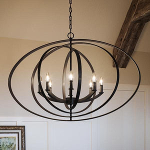 A beautiful UHP2332 Industrial Chic Chandelier, 26-3/8"H x 39"W, hanging over a dining room table.