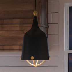 A gorgeous Urban Ambiance Americana Modern Pendant lighting fixture, 16-3/4"H x 8-3/8"W, Midnight Black Finish from the Cincinnati Collection hanging over a beautiful kitchen
