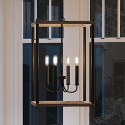 A unique and gorgeous UHP2382 Modern Farmhouse Narrow Chandelier, 25"H x 14"W, Olde Bronze Finish, Leeds Collection by Urban Ambiance hanging over a window in a