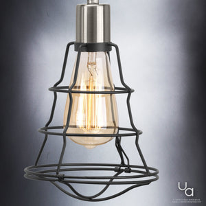 Featuring an exposed filament bulb within a metal cage, the Urban Ambiance UHP2421 Vintage Bathroom Vanity Light from the Syracuse Collection evokes vintage industrial design in its 11-inch high by 25.125-inch wide form, finished in striking charcoal and displayed elegantly against a gray gradient background.
