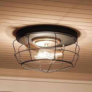 An Urban Ambiance UHP2423 Vintage Ceiling Lighting Fixture featuring a unique cage design, 6.75"H x 14"W, with a Charcoal Finish from the Syracuse Collection.