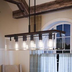 An Urban Ambiance UHP2440 Modern Farmhouse Modern Chandelier, a unique and gorgeous lighting fixture, in a dining room.