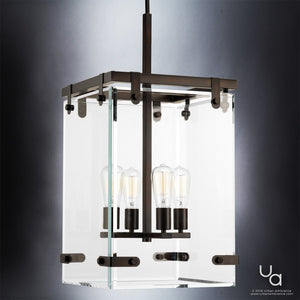 Introducing the UHP2442 Modern Farmhouse Modern Chandelier from the Bristol Collection by Urban Ambiance—measuring 28-3/8″ high and 14-3/4″ square, with an elegant Olde Bronze finish. Featuring a rectangular glass enclosure and four exposed bulbs suspended from a sleek black metal rod, this fixture beautifully captures classic farmhouse charm while blending seamlessly with contemporary décor, making it the ideal choice for those who value both timeless character and modern sophistication.