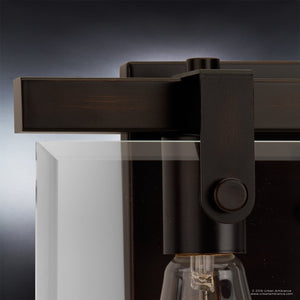 Close-up of the Urban Ambiance UHP2452 Modern Farmhouse Modern Bath Fixture from the Bristol Collection, featuring an Olde Bronze finish, clear beveled glass cover, and exposed bulb against a gradient background—highlighting the sophisticated charm of this 8-3/8″H x 14-7/8″W modern light fixture.