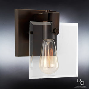 Introducing the Urban Ambiance UHP2454 Modern Farmhouse Bath/Wall Light from the Bristol Collection—an 8-3/8″ high by 7″ wide fixture featuring an Olde Bronze finish and clear beveled glass panels. This contemporary bath light blends timeless style with modern elegance, perfectly showcasing its exposed Edison-style bulb.