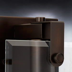 Close-up of the UHP2454 Modern Farmhouse Modern Bath / Wall Light from the Bristol Collection by Urban Ambiance, featuring an Olde Bronze finish and measuring 8-3/8″ high by 7″ wide, displayed against a gradient background.