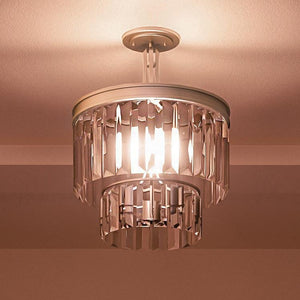 A unique UHP2466 Cosmopolitan Ceiling Light with an Antique Silver Finish from Urban Ambiance adds a beautiful touch to any room with a brown ceiling.