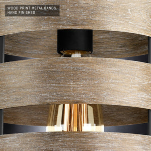 Close-up of the UHP2472 Modern Farmhouse Pendant from Urban Ambiance’s Adelaide Collection, featuring wood print metal bands in a hand-finished charcoal finish and a visible filament bulb that highlights its rustic modern design. Text: “Wood print metal bands, hand finished.”.