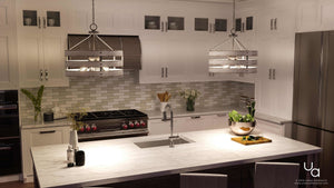 A beautiful kitchen with white cabinets and the Urban Ambiance UHP2475 Modern Farmhouse Chandelier as a gorgeous lamp.