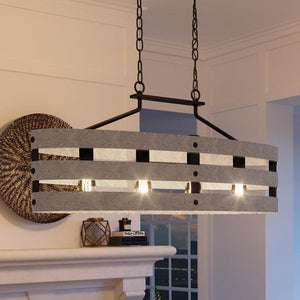 A gorgeous Urban Ambiance UHP2476 Modern Farmhouse Chandelier, 17"H x 38-1/2"W, Charcoal Finish from the Adelaide Collection hanging over a fireplace