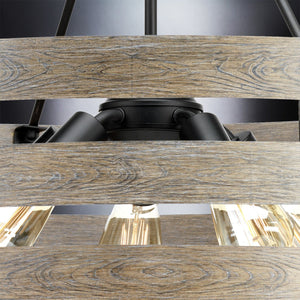 Close-up of the UHP2478 Modern Farmhouse Chandelier from Urban Ambiance’s Adelaide Collection, featuring a charcoal finish with black metal accents and wooden slats. Exposed bulbs highlight this striking 22-3/4″H x 27-3/4″W rustic modern pendant light, seamlessly blending warmth with industrial flair.