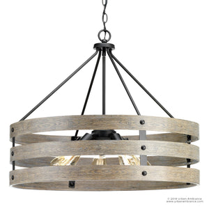 The UHP2478 Modern Farmhouse Chandelier from the Adelaide Collection by Urban Ambiance features a round black metal frame with three wooden rings, exposed bulbs, and chain suspension. Measuring 22-3/4″ high by 27-3/4″ wide and finished in hand-finished charcoal, this open-cage chandelier blends rustic modern style for a striking yet versatile statement in any room.