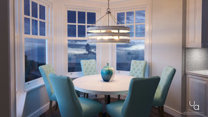 A beautiful dining room with a unique Modern Farmhouse chandelier and luxury turquoise chairs.
