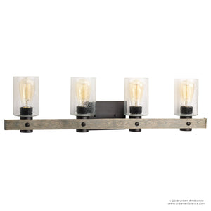 The Urban Ambiance UHP2486 Modern Farmhouse Bath Fixture from the Adelaide Collection features a charcoal finish, a wooden base, and four exposed filament bulbs set within clear cylindrical glass shades—an ideal wall-mounted vanity light to complement your rustic décor and pair beautifully with a farmhouse-inspired ceiling fan for a cohesive modern bathroom look.