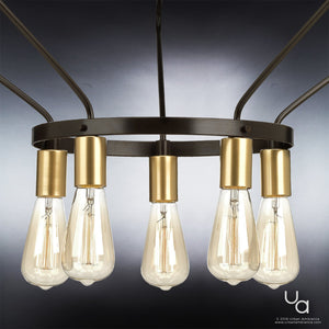 The UHP2492 Mid-Century Modern Industrial Chandelier from the Palma Collection by Urban Ambiance hangs from the ceiling, featuring a 19-3/4″ high by 30″ wide circular geometric design with an Olde Bronze finish and eight exposed Edison bulbs.