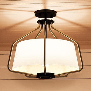 A gorgeous Urban Ambiance ceiling lamp with a white shade.