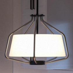 A unique lighting fixture from the Palma Collection by Urban Ambiance hangs with a white shade over a kitchen counter.