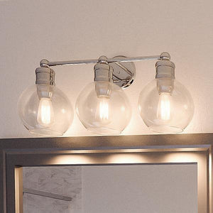 An Urban Ambiance UHP2503 Vintage Bath Fixture with three beautiful lights and a mirror.