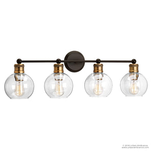 The Urban Ambiance UHP2504 Vintage Industrial Bath Fixture from the Belfast Collection features four clear glass globes, vintage-inspired lighting elements, and an Olde Bronze finish; exposed filament bulbs are elegantly mounted on a horizontal bar. Measuring 10-7/8″ high by 33-1/2″ wide, this bath fixture combines classic charm with industrial appeal.