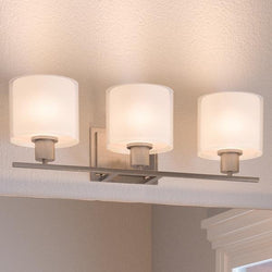An Urban Ambiance UHP2512 Cosmopolitan Bathroom Vanity Light with unique three light shades.