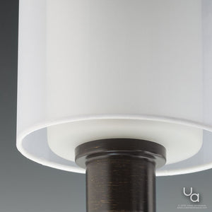 Close-up of the Urban Ambiance UHP2513 Cosmopolitan Bathroom Vanity Light from the Tacoma Collection, featuring a sleek Olde Bronze finish and measuring 7.375 inches high by 23.5 inches wide, set against a neutral background.