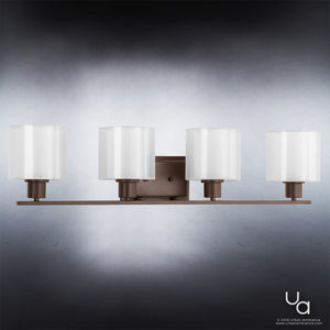 The Urban Ambiance UHP2515 Cosmopolitan Bathroom Vanity Light from the Tacoma Collection features four Mylar cylinder shades and an Olde Bronze finish, elegantly showcased against a light gradient background.