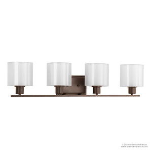 The UHP2515 Cosmopolitan Bathroom Vanity Light from Urban Ambiance’s Tacoma Collection is a four-light fixture with elegant cylindrical mylar shades and a sleek Olde Bronze finish, highlighted by a bronze rectangular backplate. Measuring 7.375 inches high by 32.5 inches wide, it adds sophisticated style to any bathroom space.