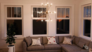 A living room with beautiful lighting fixture.