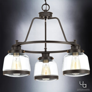 The Urban Ambiance UHP2533 Luxe Industrial Chandelier from the Nottingham Collection, featuring three artisan-style glass globes and an Olde Bronze finish, is shown against a gradient gray background.