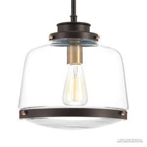 A unique UHP2535 pendant light with a brass finish and glass shade.