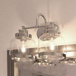 A gorgeous bathroom with a mirror and two Urban Ambiance UHP2536 Industrial Chic Bathroom Vanity Lights, 11.25