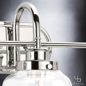 A gorgeous UHP2538 Industrial Chic Bathroom Vanity Light with a clear glass shade, from the Urban Ambiance Nottingham Collection, featuring a Polished Nickel Finish, measuring 11.25