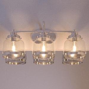 Three beautiful UHP2538 Industrial Chic Bathroom Vanity Lights, 11.25"H x 26"W, Polished Nickel Finish, Nottingham Collection by Urban Ambiance hanging on a wall in a bathroom