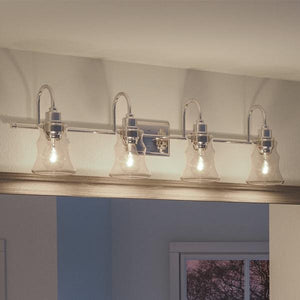 A luxury vintage bathroom vanity light fixture with four light bulbs.