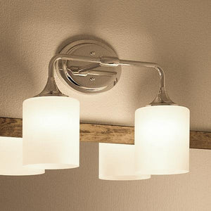 The Urban Ambiance UHP2570 Contemporary Bathroom Vanity Light from the Coventry Collection features two illuminated cylindrical frosted glass shades mounted on a polished chrome metallic base, making it an elegant choice for contemporary bathroom lighting. Measuring 11.125″ high by 14.5″ wide, it is the perfect wall-mounted fixture to enhance a modern space.