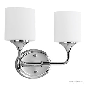 The Urban Ambiance UHP2570 Contemporary Bathroom Vanity Light from the Coventry Collection features a polished chrome finish with two cylindrical etched opal glass shades mounted on a round base, measuring 11.125″ high by 14.5″ wide—an ideal modern bath light fixture for any contemporary bathroom design.
