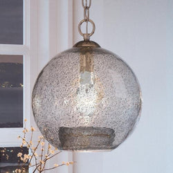 An Urban Ambiance UHP2582 Vintage Pendant, a unique luxury lamp with a brushed nickel finish from the Birmingham Collection hanging from it.