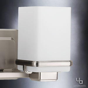 A gorgeous Modena Collection luxury bathroom vanity light fixture with a square glass shade.