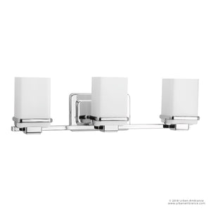 The Urban Ambiance UHP2603 Transitional Bathroom Vanity Light from the Modena Collection features three frosted rectangular glass shades and a polished chrome finish, making it an ideal contemporary bath fixture that measures 6.5″ high by 22.125″ wide.