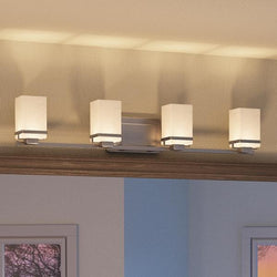 A beautiful transitional bathroom vanity light with four luxury lights.