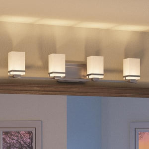 A beautiful transitional bathroom vanity light with four luxury lights.
