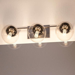 Three luxurious UHP2621 Modern Bath Fixtures hanging on a beautiful wall, made by Urban Ambiance.