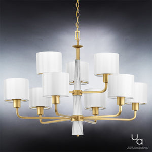 The Urban Ambiance UHP2630 XL Cosmopolitan Chandelier from the Oxford Collection features a Palladian Gold finish with ten white drum lampshades arranged in two tiers, elegant marble accents, and is suspended by a matching chain, set against a gradient gray background.