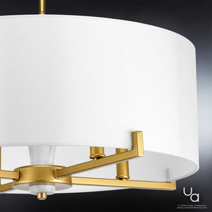 Close-up of the Urban Ambiance UHP2632 Cosmopolitan Drum Chandelier from the Oxford Collection, featuring a white cylindrical shade with Palladian Gold accents, measuring 9-5/8″ high by 22″ wide, set against a dark background.