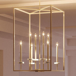 Keywords: luxury, lighting fixture
Modified Description: A luxurious UHP2634 Cosmopolitan Chandelier with a Palladian Gold Finish from the Oxford Collection by Urban Ambiance illuminating a room.