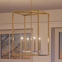 A gorgeous lighting fixture, the UHP2635 Cosmopolitan Chandelier from the Oxford Collection by Urban Ambiance, hangs over a window in a living room.